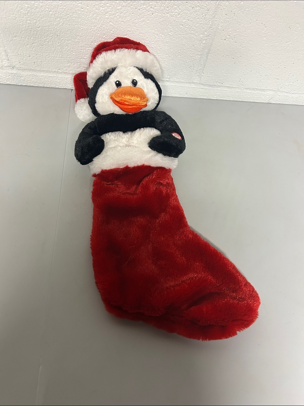 Dandee animated Christmas stocking singing penguin lights up